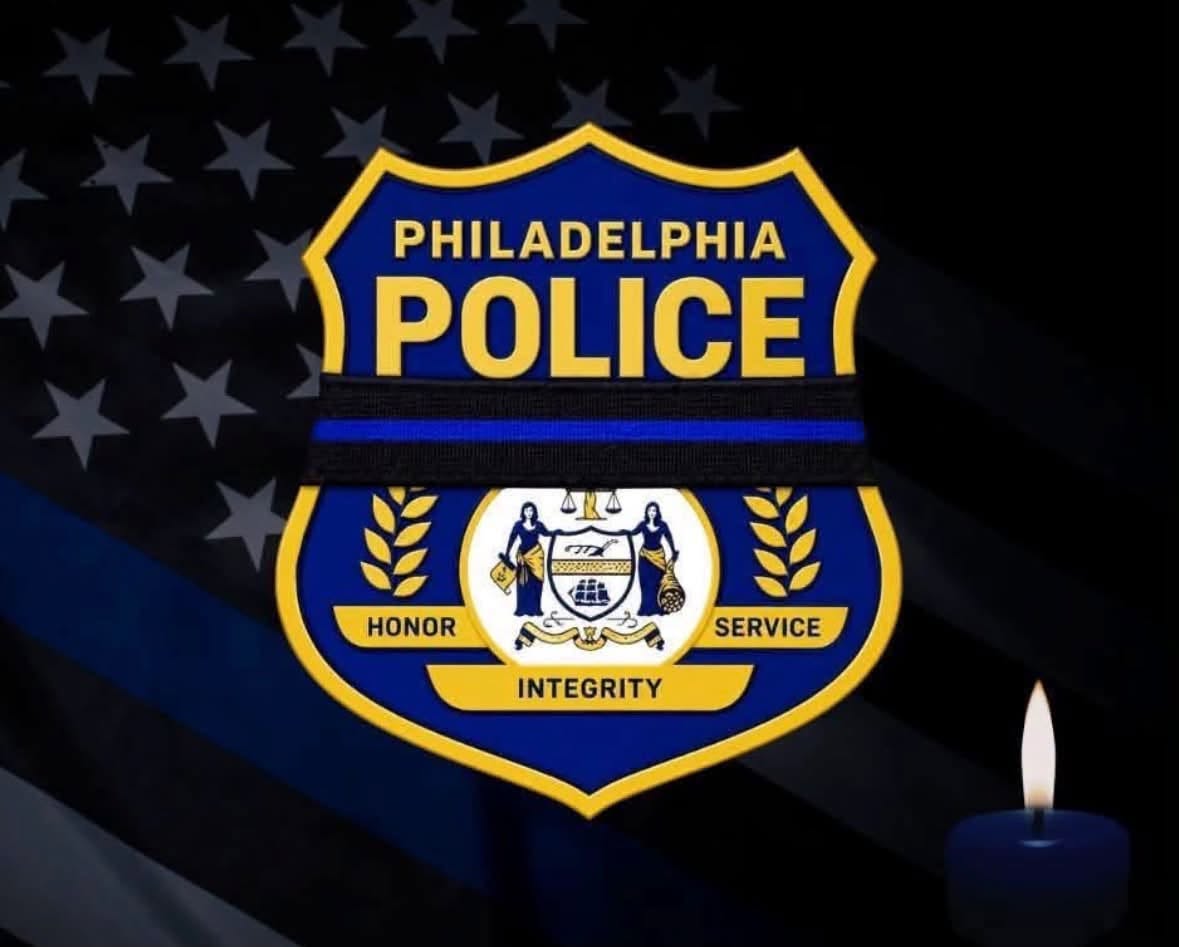 Philadelphia Police logo with black and blue line through with police flag in background and candle in foreground. &nbsp;